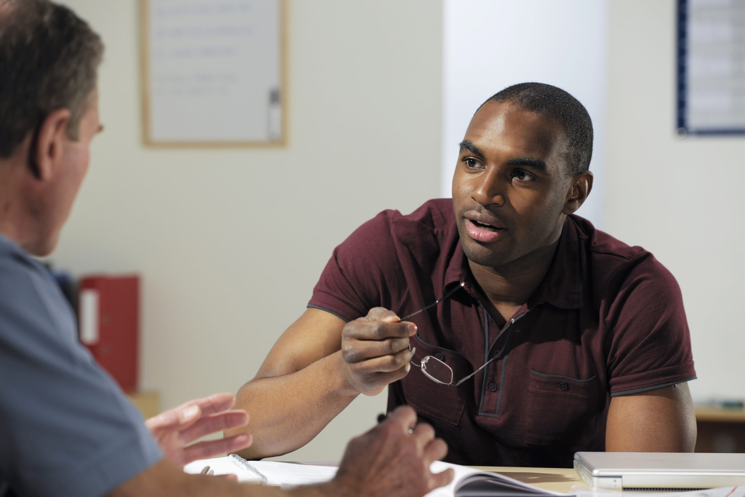 A restoration contractor and his customer discussing Assignment of Policy and Assignment of Post-Loss Benefits