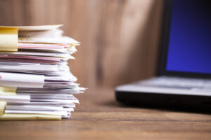 Stacks of documentation to support an insurance claim for restoration work