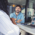 A candidate interviews for a role as an insurance claims manager at a restoration company.