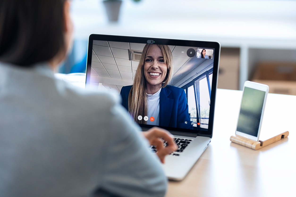 Account manager communicating via video call with their restoration contractor client.