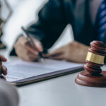 Restoration industry lawyer discussing litigation with a client.