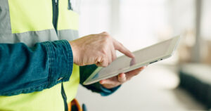 Team member training restoration technicians on using documentation software on site