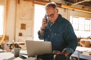 Restoration contractor on the phone with a provider after restoration adjuster pushback.