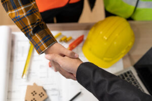 OCS & a contractor shake hands after discussing restoration claims billing