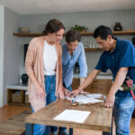 Contractor explains project plans to restoration customers.