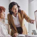 Two restoration insurance billing experts view claims data and discuss billing performance.