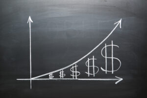 A chart drawn on a chalkboard depicting a restoration business's water damage insurance invoicing revenue growth