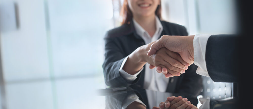 Shaking hands during an interview for a restoration insurance billing team position