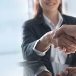 Shaking hands during an interview for a restoration insurance billing team position