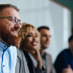 A restoration insurance billing team meets together.