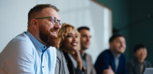 A restoration insurance billing team meets together.