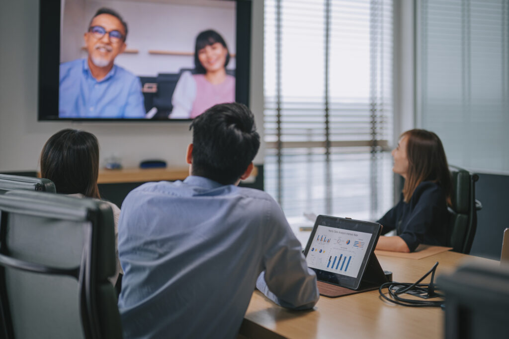 Restoration contractors on a video call about outsourcing restoration insurance billing.