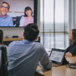 Restoration contractors on a video call about outsourcing restoration insurance billing.